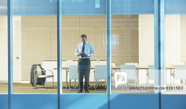 Businessman standing in conference room