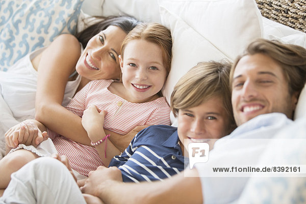 Family relaxing together on sofa