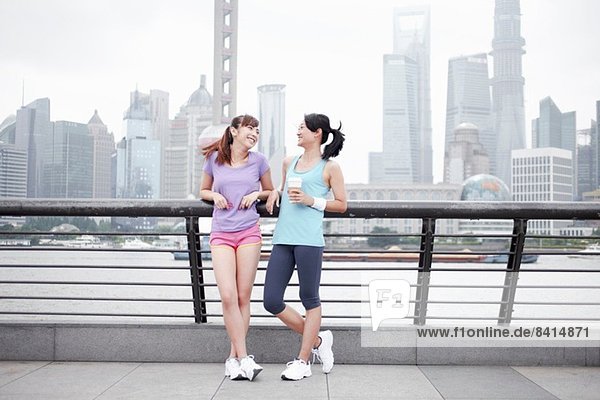 Female friends on bridge in Shanghai  China
