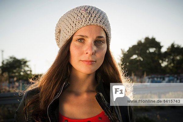 Portrait of young woman wearing beanie
