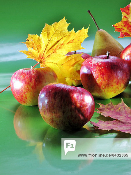Fruits  apples  red  pear  leaves  maple leaves  autumn  arranged  fruit