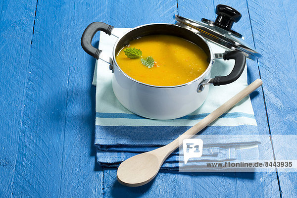 Creamed pumpkin soup in cooking pot