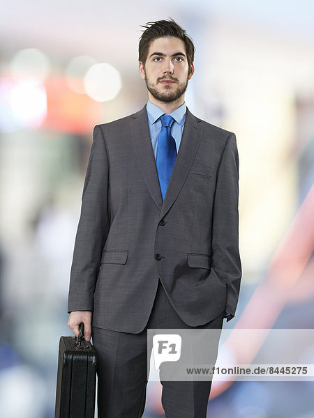 Portrait of businessman with briefcase
