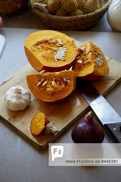 Germany  Hokkaido pumpkin on chopping board