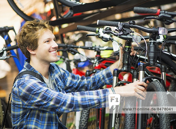 Man choosing bike in bike shop