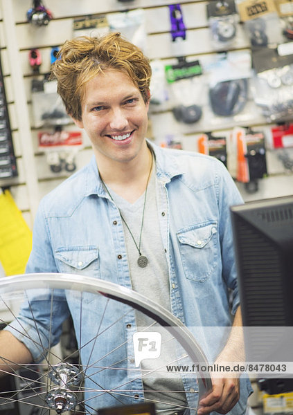 Portrait of bike shop assistant
