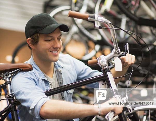 Man fixing bike in bike shop