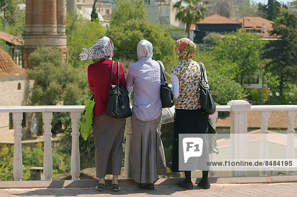 Three local woman looking at the historic centre of Antalya  Antalya province  Turkey