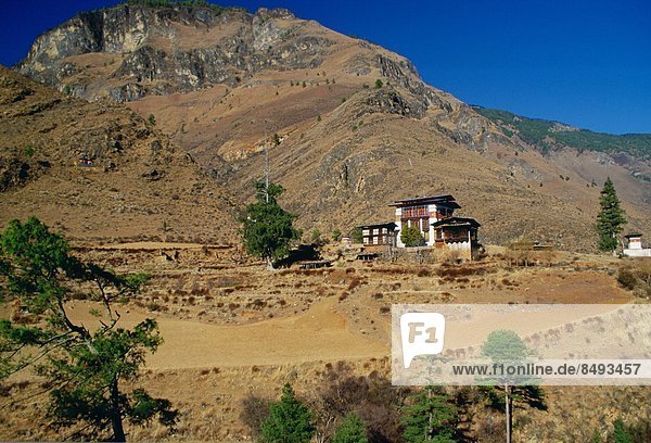 Chalet-style houses and farmland  Bhutan