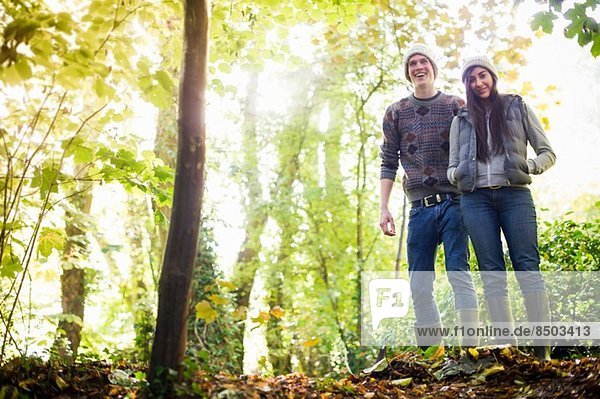 Young couple walking in forest