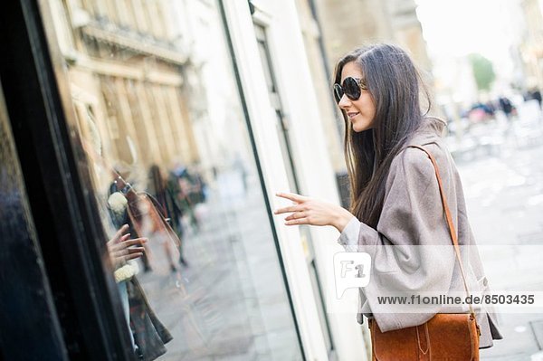 Young woman window shopping