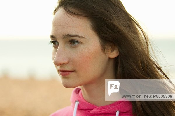 Portrait of young woman on beach  Whitstable  Kent  UK