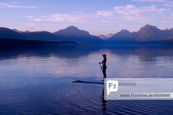 Woman on canoe  Lake McDonald  Glacier National Park  Montana  USA