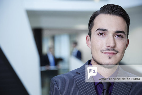 Young business man in office building