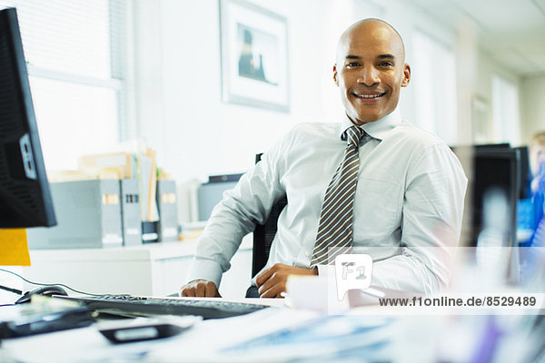 Businessman working at desk in office