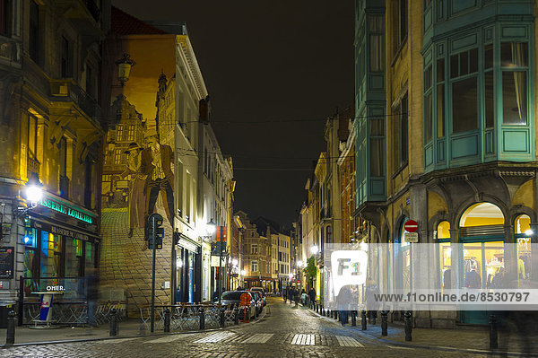 Street in the historic town centre with restaurants and bars  night scene  Brussels  Belgium