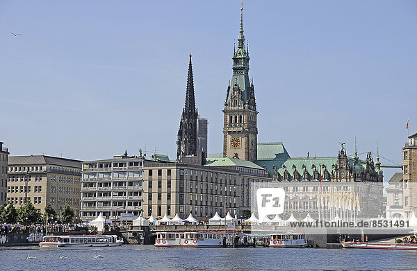 Alster lake in front of Hamburg City Hall and St. Nicholas' Church  Hamburg  Germany