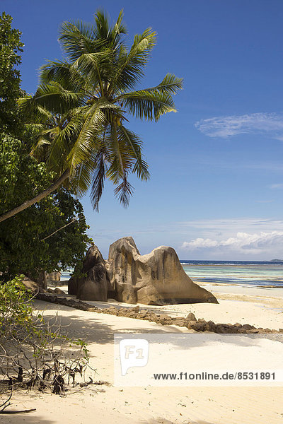 Typical rock formations in the Seychelles with a sandy beach  Anse Union  La Digue  Seychelles