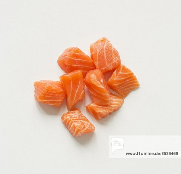Cubed Raw Salmon on a White Background