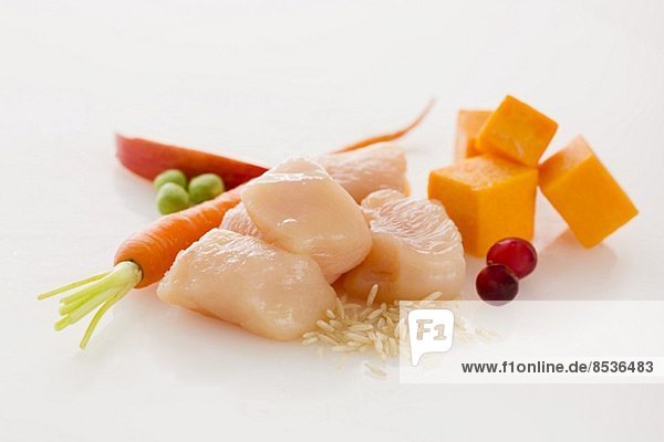 Raw Cubes of Chicken with Assorted Ingredients