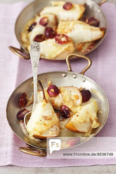 Pears topped with Taleggio and baked  served with grapes