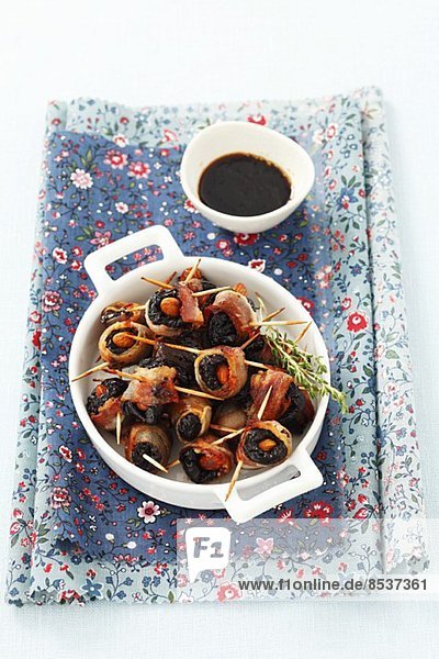 Prunes with almonds wrapped in bacon