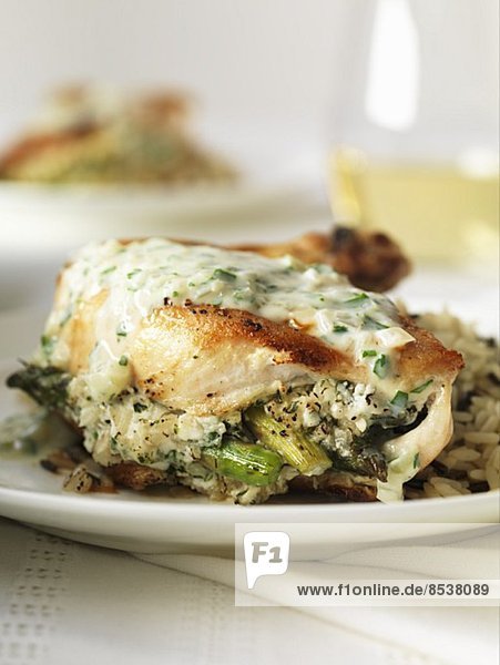 Chicken stuffed with asparagus in a white wine & shallot sauce