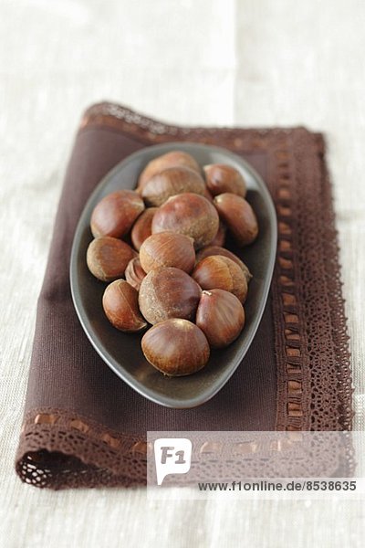Chestnuts in a bowl on a napkin
