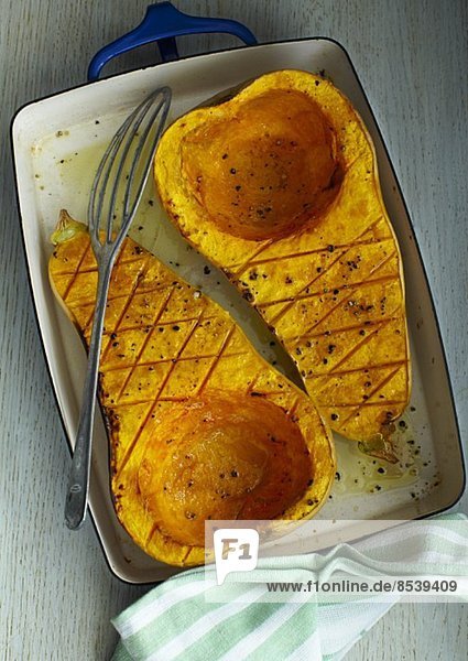 Roasted butternut squash in a roasting tin