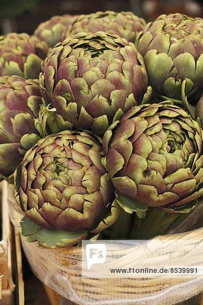 Artichokes in a basket at the market