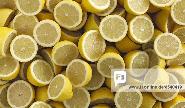 Lots of lemons cut in half (filling the image)
