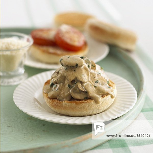 English muffin with mushrooms sauce