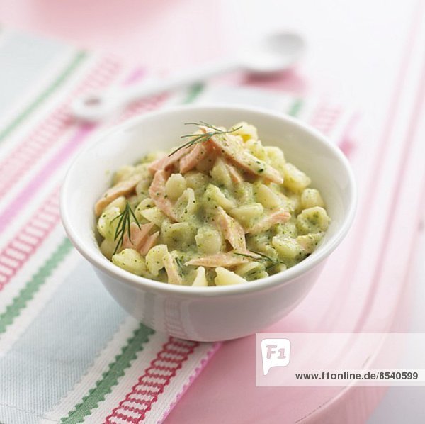 Pasta shells with strips of salmon in a broccoli sauce