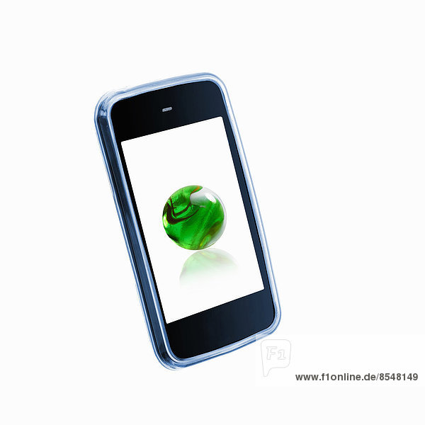 Ein kleines tragbares Kommunikationsgerät oder Telefon mit einer grünen Kugel oder Kugel auf dem Bildschirm.