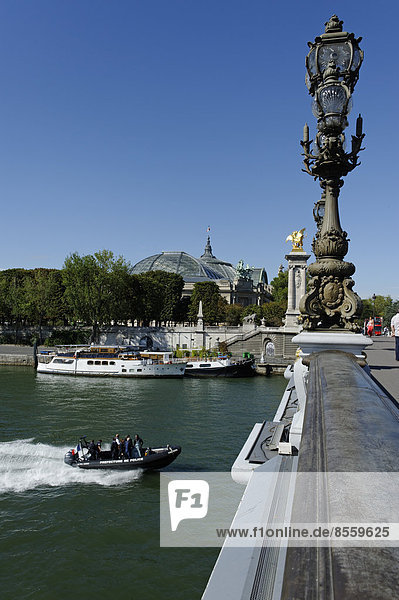 Pont Alexandre III bridge with the Seine and ship traffic  Paris  France