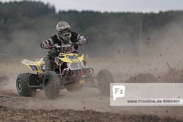 Quad rider on a field Höfen Lower Allgäu Bavaria Germany