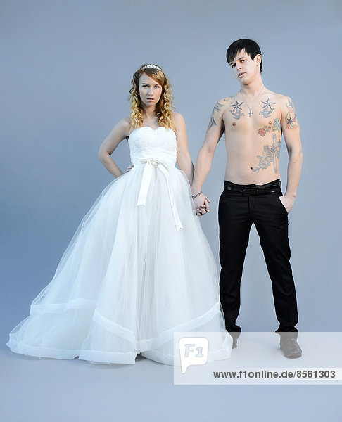 Wedding picture  bride and groom  bare chested groom with tattoos