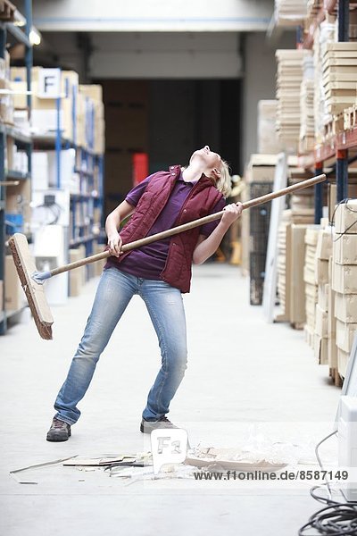 France  young woman working in a warehouse.