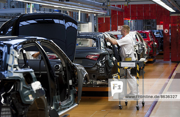 Man working on the production line of the Audi A3 at the Audi plant  Ingolstadt  Bavaria  Germany