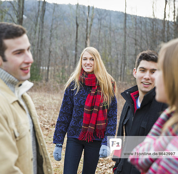 A group of four people outdoors on a winter day.