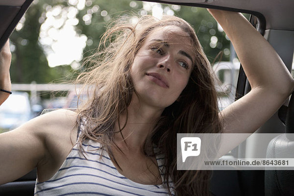Young woman sitting in car  Close-up