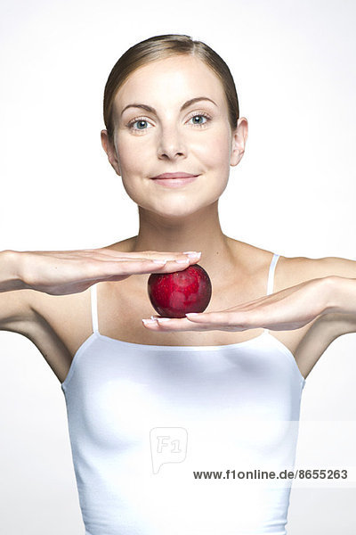 Young woman with apple
