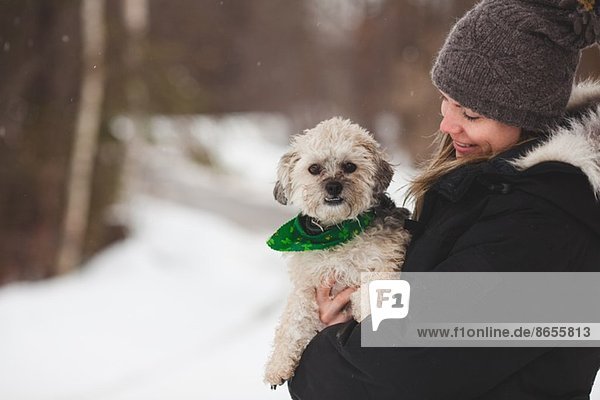 Woman with pet dog outdoors