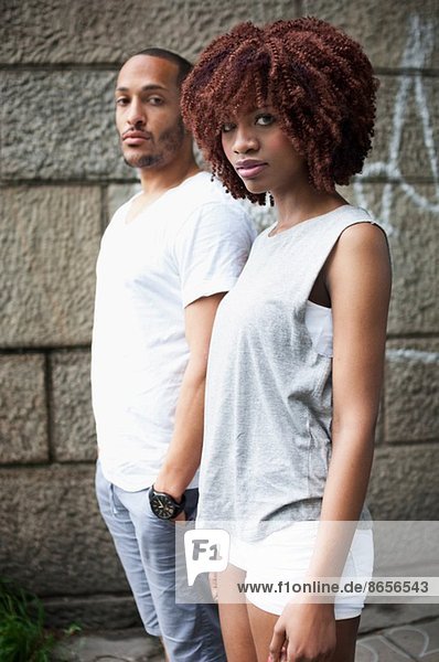 Portrait of serious young couple looking at camera