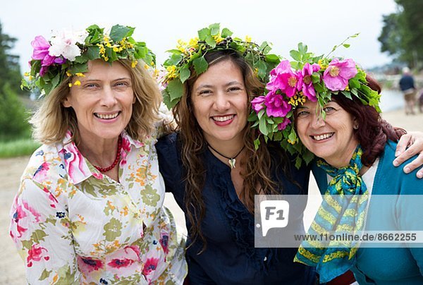 Three women posing together  Nykoping  Sodermanland  Sweden