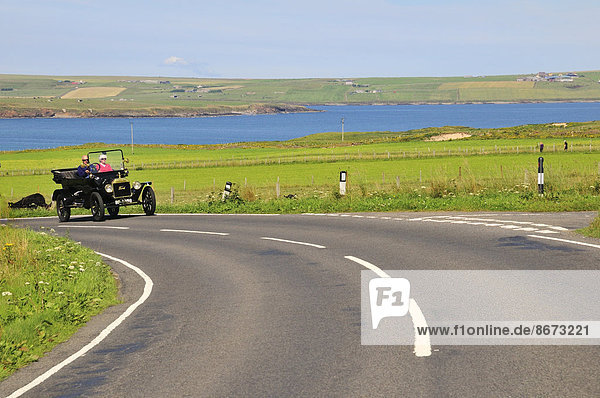 A Tin Lizzie  Ford Model T  on the road at the bay of Scapa Flow  South Ronaldsay  Orkney  Scotland  United Kingdom