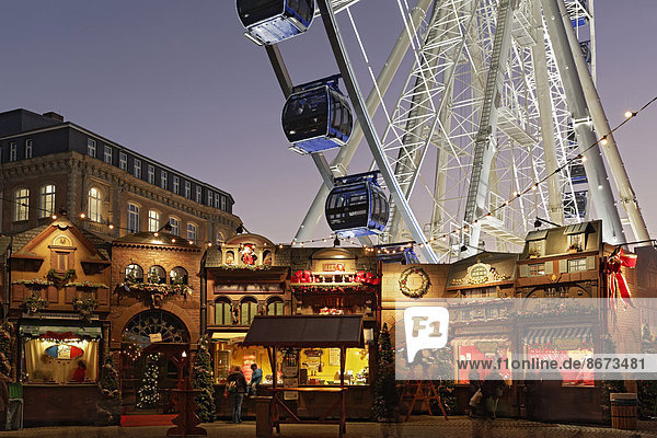 Christmas market with a ferris wheel on Burgplatz square  historic town centre  Düsseldorf  North Rhine-Westphalia  Germany
