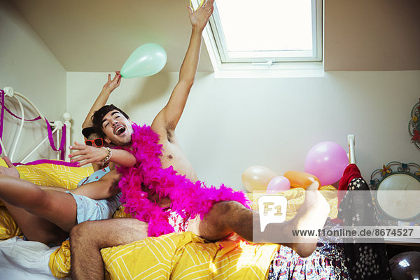 Couple having party in bedroom