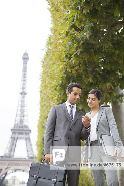 Business people talking near Eiffel Tower  Paris  France