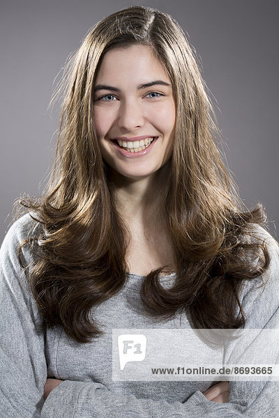 Portrait of smiling young woman  studio shot